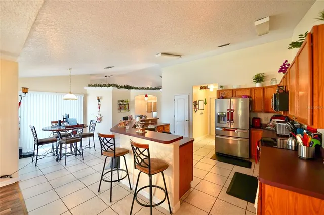 a kitchen with a refrigerator and washer
