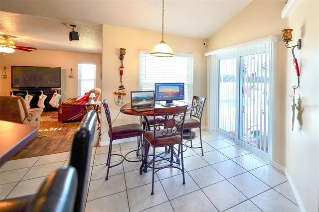a view of a house with a backyard and porch