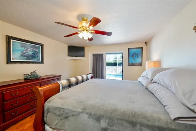 a bedroom with furniture and a chandelier
