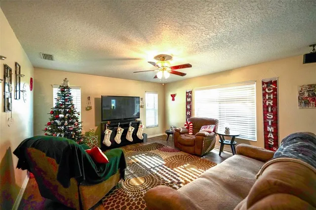 a bed room with a bed and a mirror on the dresser