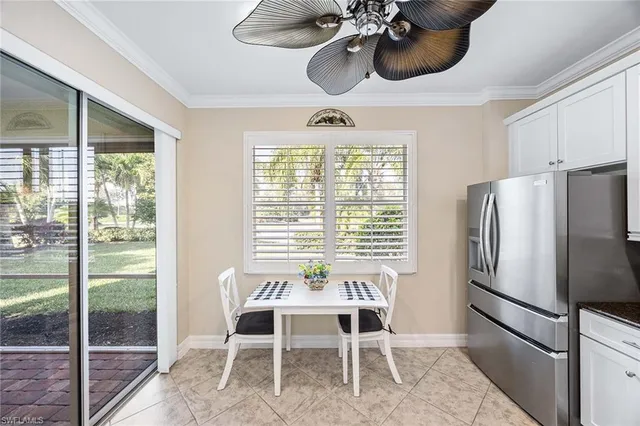 a kitchen with a table and chairs