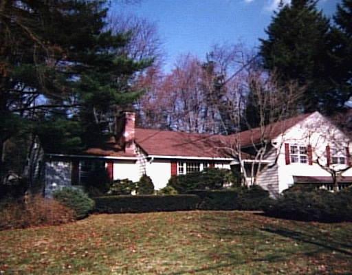 6 Juniper Road Westport, CT 06880 - Photo 1 of 1 a view of house with garden and tall trees