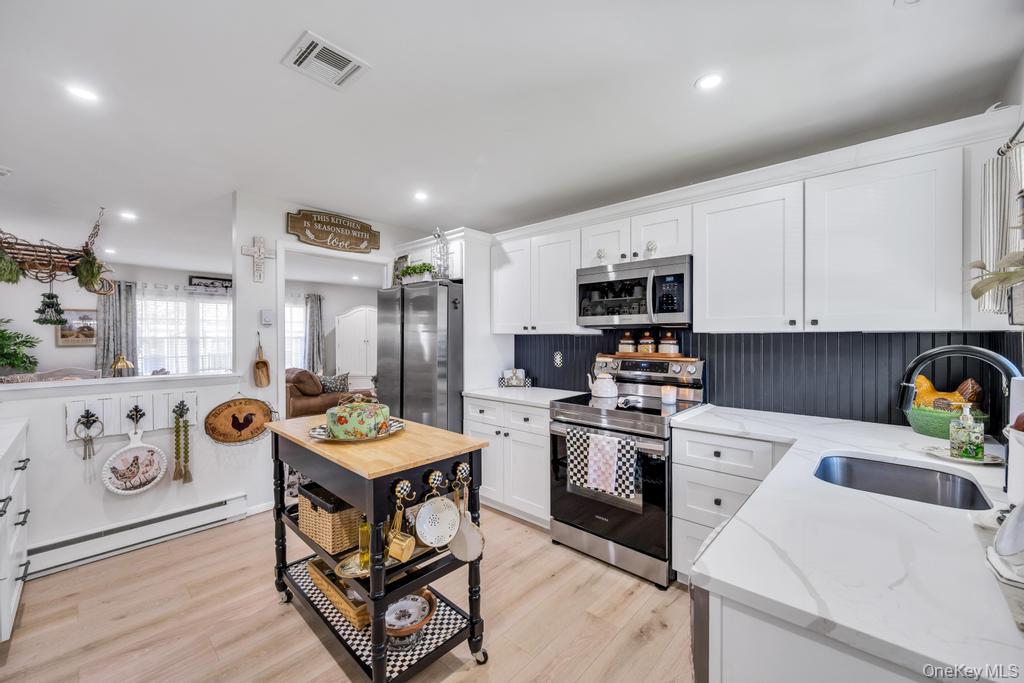 248 Newcastle Court, Unit A Ridge, NY 11961 - Photo 4 of 40