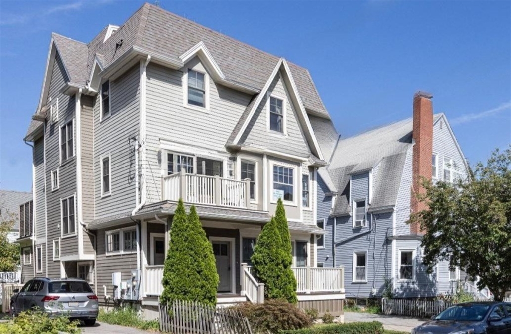19 Harris Street, Unit 2 Brookline, MA 02446 - Photo 1 of 31 a view of a white building among the street