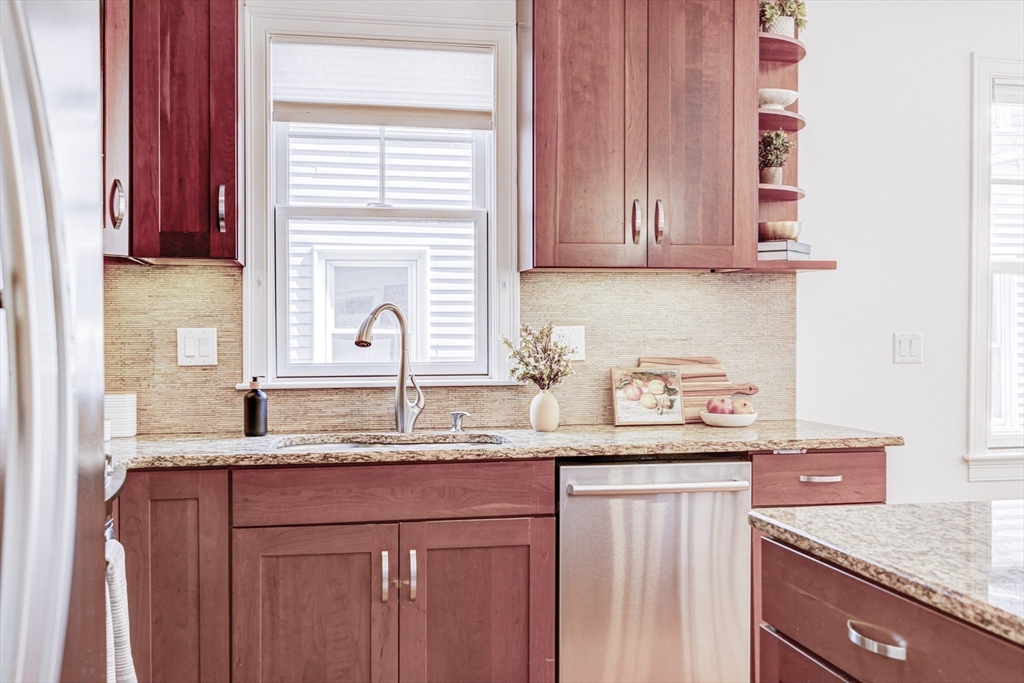 19 Harris Street, Unit 2 Brookline, MA 02446 - Photo 15 of 31 a kitchen with granite countertop cabinets sink and window