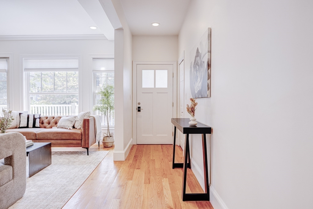 19 Harris Street, Unit 2 Brookline, MA 02446 - Photo 17 of 31 a hallway with furniture and wooden floor