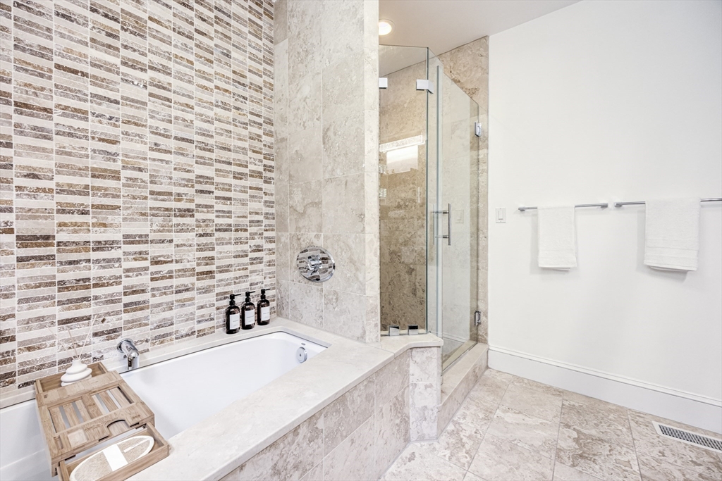 19 Harris Street, Unit 2 Brookline, MA 02446 - Photo 22 of 31 a bathroom with a bathtub and shower