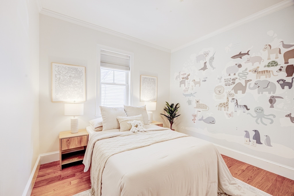 19 Harris Street, Unit 2 Brookline, MA 02446 - Photo 24 of 31 a bedroom with a bed and a window