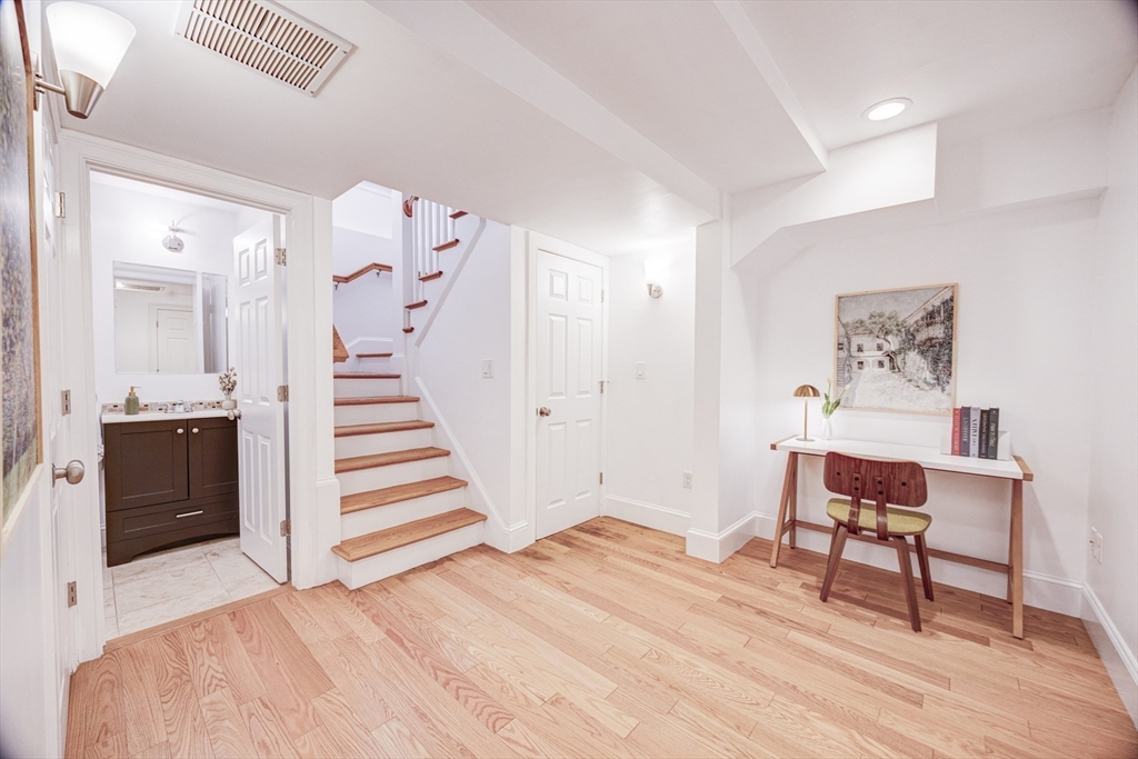 19 Harris Street, Unit 2 Brookline, MA 02446 - Photo 26 of 31 a bedroom with a bed and a workspace