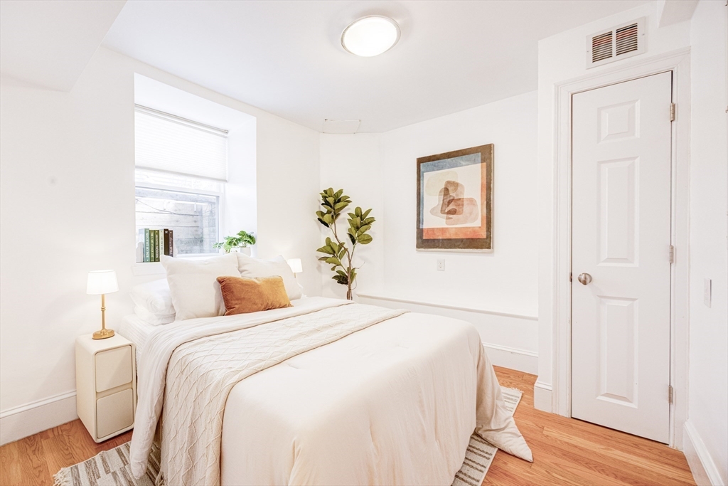 19 Harris Street, Unit 2 Brookline, MA 02446 - Photo 28 of 31 a bedroom with a bed and a window