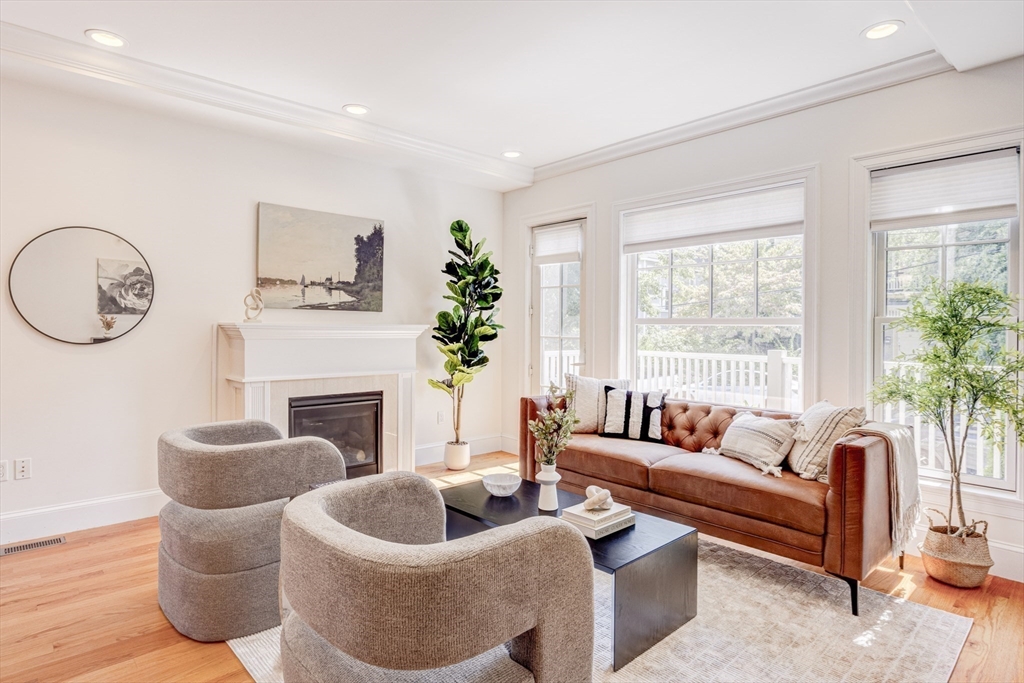 19 Harris Street, Unit 2 Brookline, MA 02446 - Photo 3 of 31 a living room with furniture and a large window