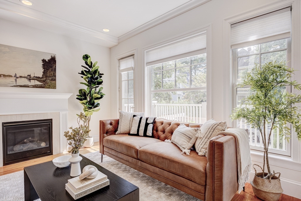 19 Harris Street, Unit 2 Brookline, MA 02446 - Photo 4 of 31 a living room with furniture and a fireplace