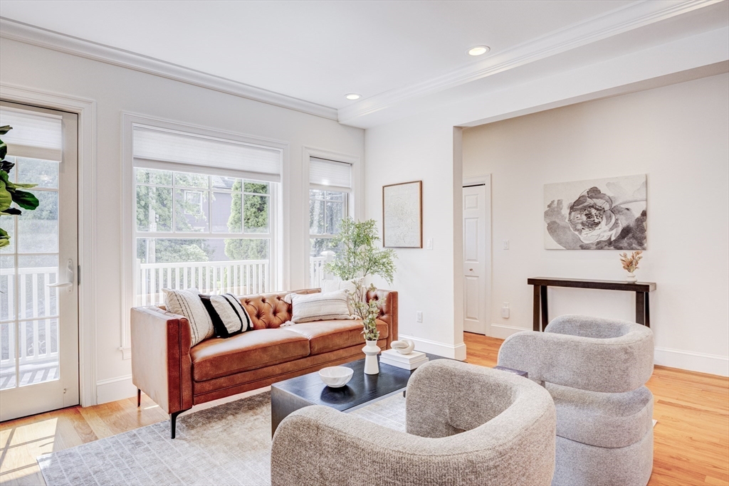 19 Harris Street, Unit 2 Brookline, MA 02446 - Photo 5 of 31 a living room with furniture and a large window