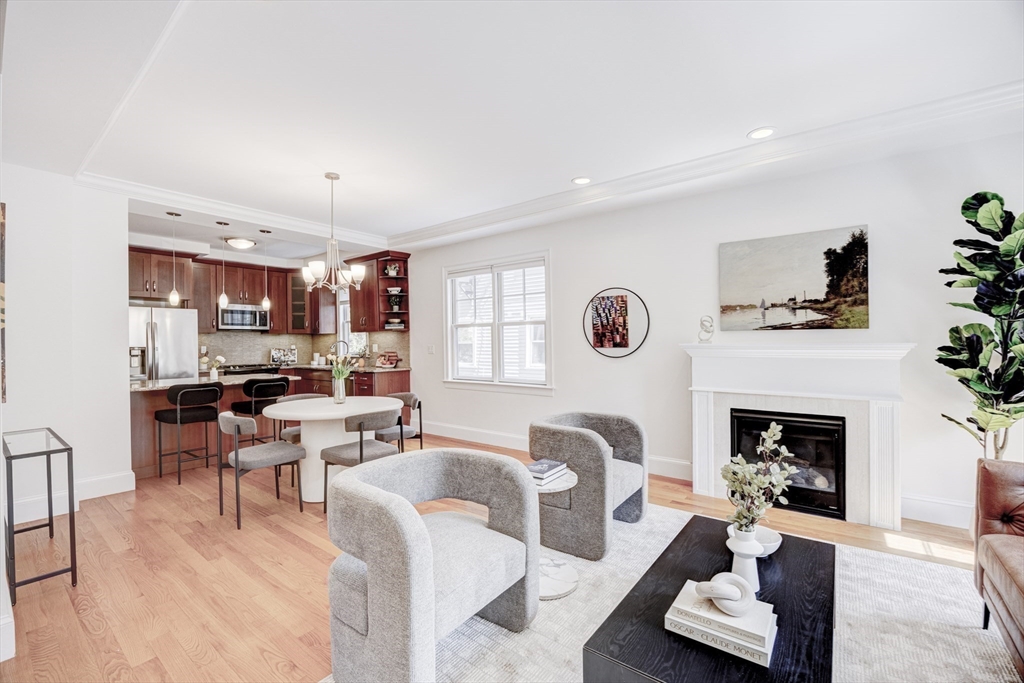19 Harris Street, Unit 2 Brookline, MA 02446 - Photo 8 of 31 a living room with furniture and a fireplace