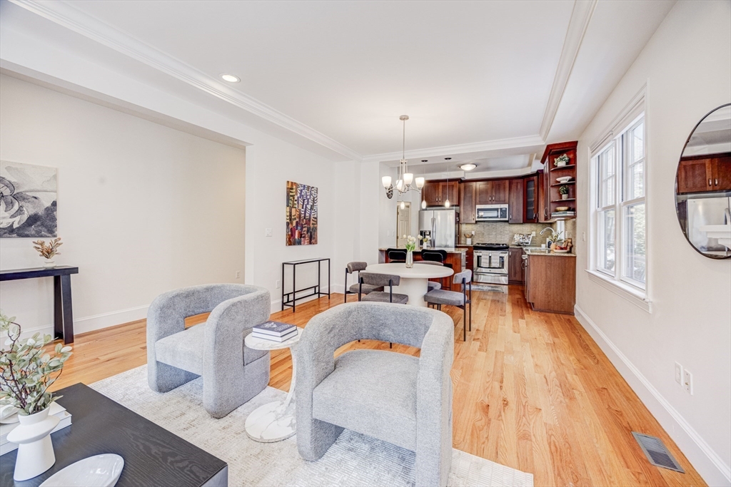 19 Harris Street, Unit 2 Brookline, MA 02446 - Photo 9 of 31 a living room with furniture and a wooden floor