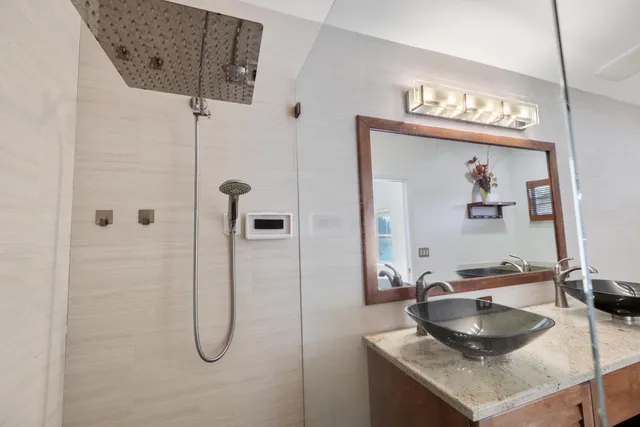 a bathroom with a white bath tub and a window
