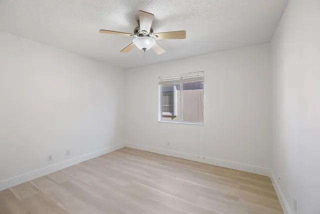 a bathroom with a sink a toilet a shower and a mirror