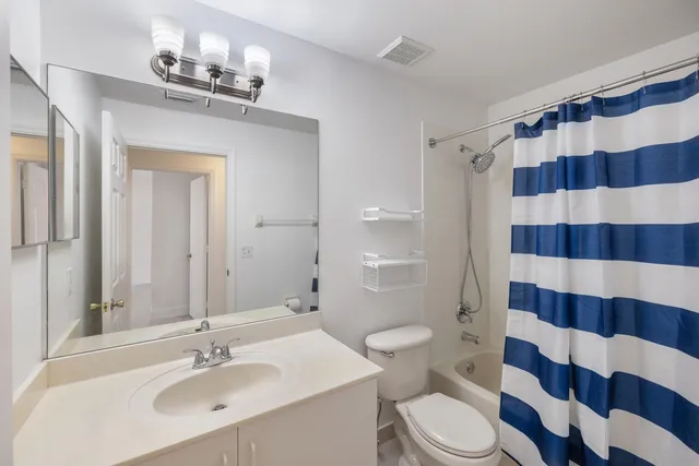 a view of a kitchen with a sink and dishwasher