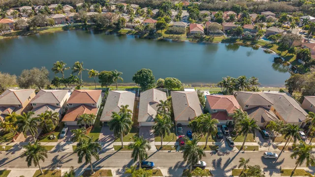 an aerial view of a houses with ocean view
