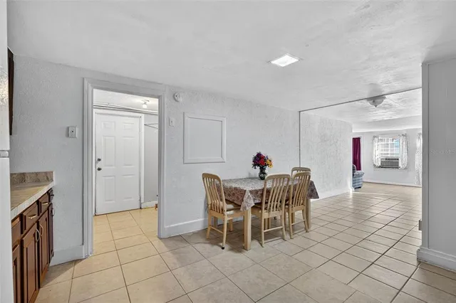a kitchen with stainless steel appliances granite countertop a refrigerator and a stove