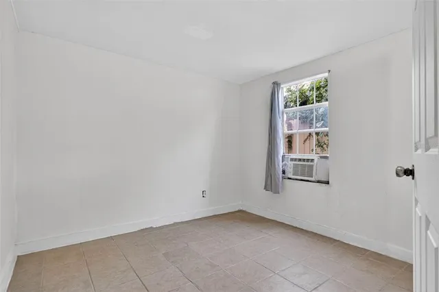 a kitchen with a refrigerator and a sink