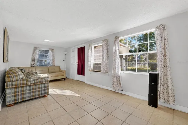 a view of kitchen with a sink and a window