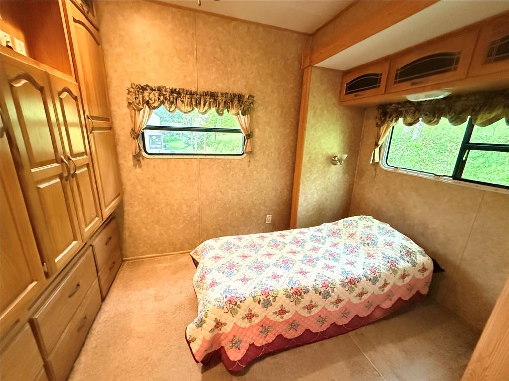 321 Dark Hollow Road Confluence, PA 15424 - Photo 10 of 18 a bedroom with a bed and a window