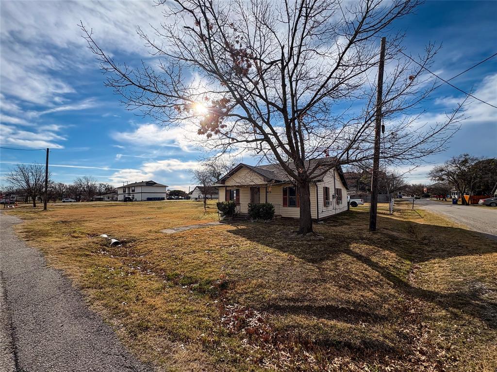 412 West Beech Street Celina, TX 75009 - Photo 2 of 17 a view of a yard with a large tree