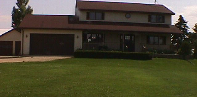 2913 Shattuck Road Belvidere, IL 61008 - Photo 2 of 6 a house view with a garden space