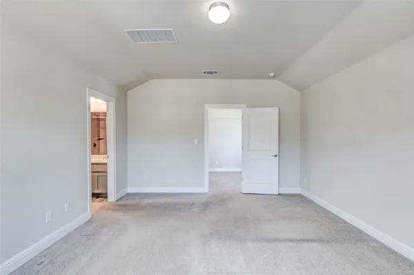 a bathroom with a glass shower door