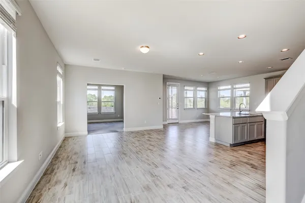 a view of a house with a yard and sitting area