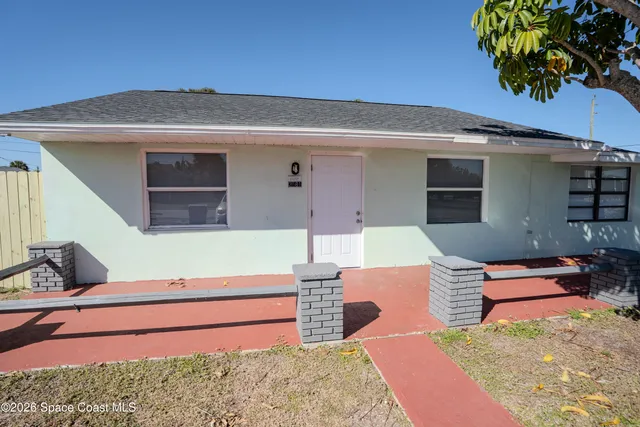 a backyard of a house with seating space