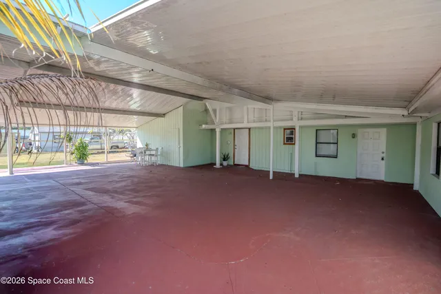 a view of a house with a garden and pathway