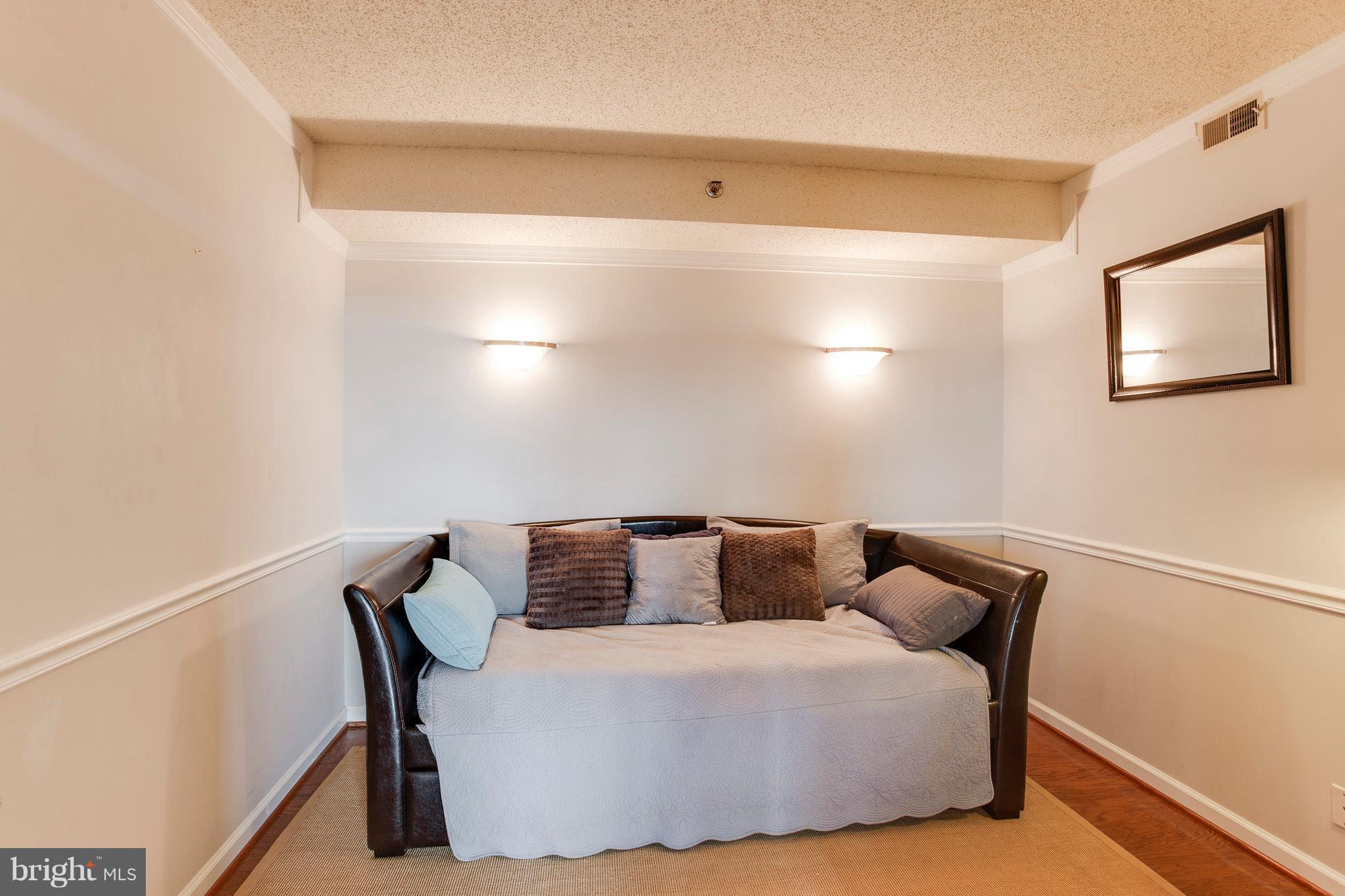 5505 Seminary Road, Unit 2211N Falls Church, VA 22041 - Photo 18 of 30 a bedroom with a bed and a table in it