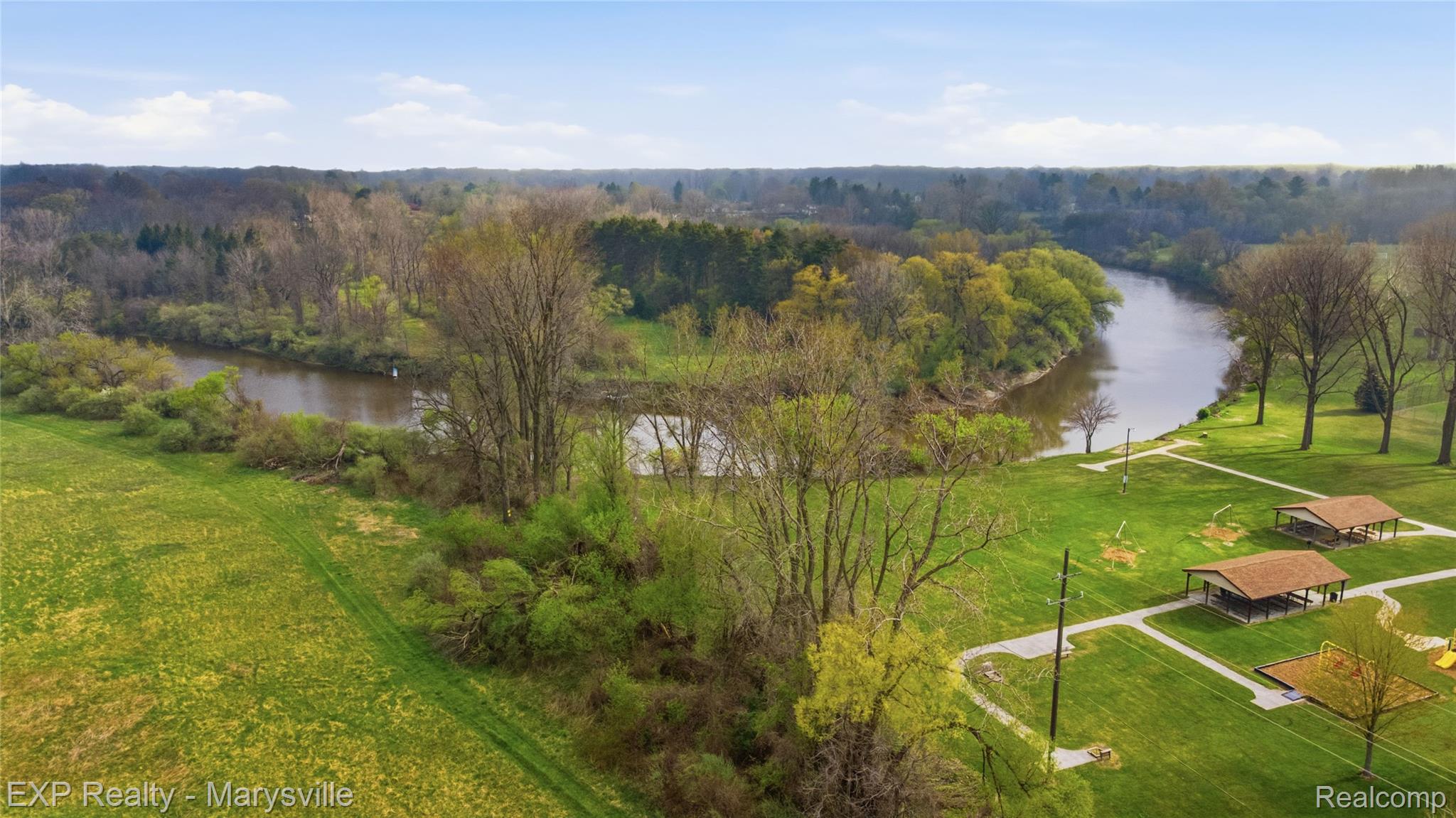 3345 Beach Road Port Huron, MI 48060 - Photo 76 of 89 Drone / aerial view of a nearby body of water and a forest