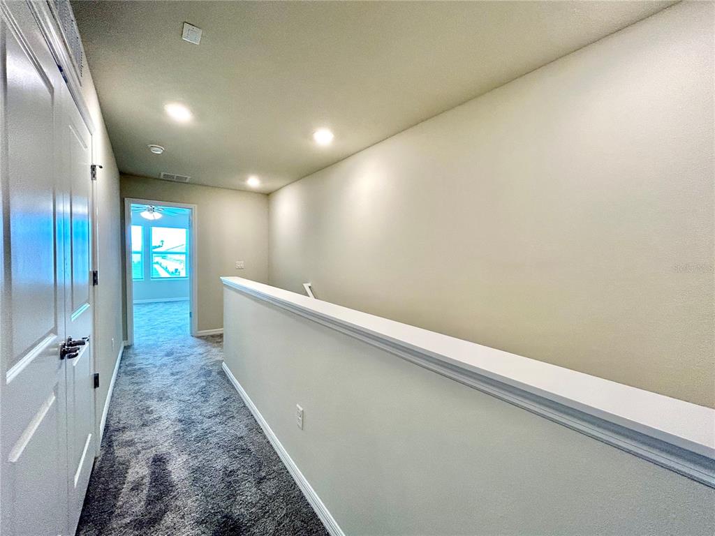 4652 Sparkling Shell Avenue Kissimmee, FL 34746 - Photo 11 of 35 an entryway with a hallway