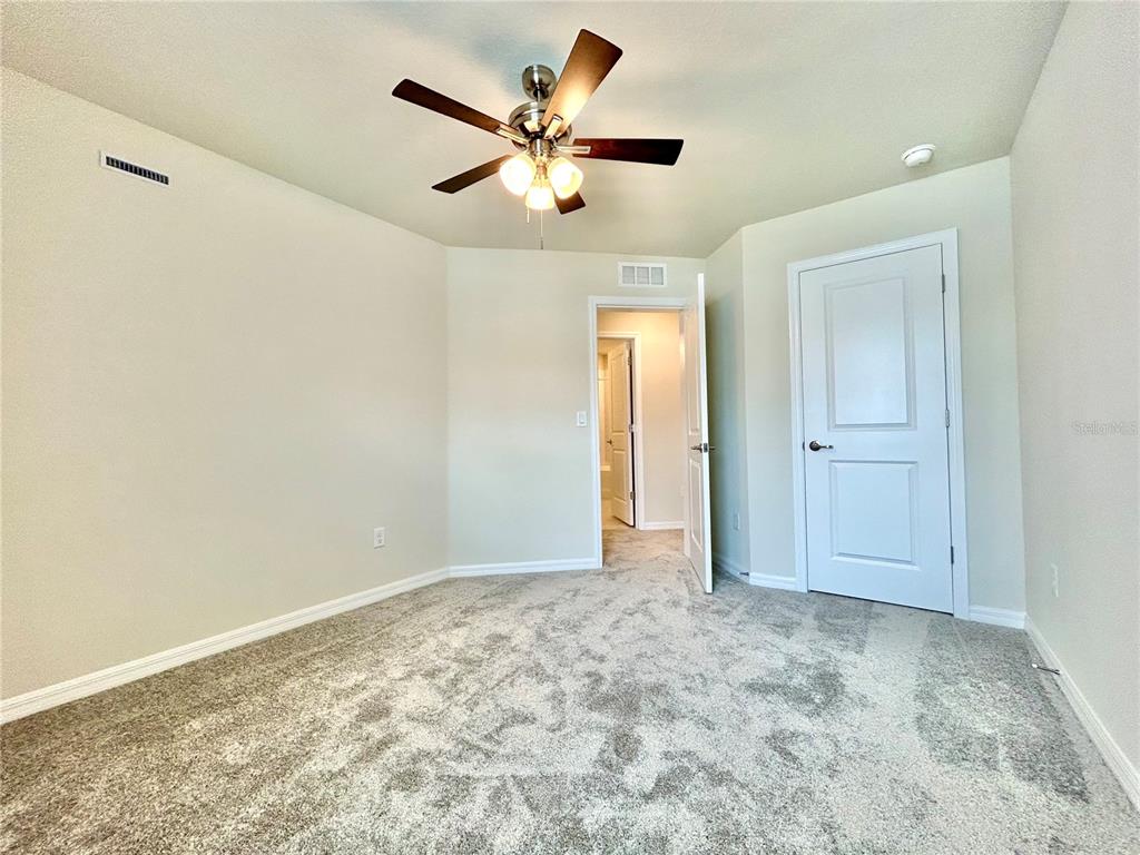 4652 Sparkling Shell Avenue Kissimmee, FL 34746 - Photo 15 of 35 wooden floor in an empty room