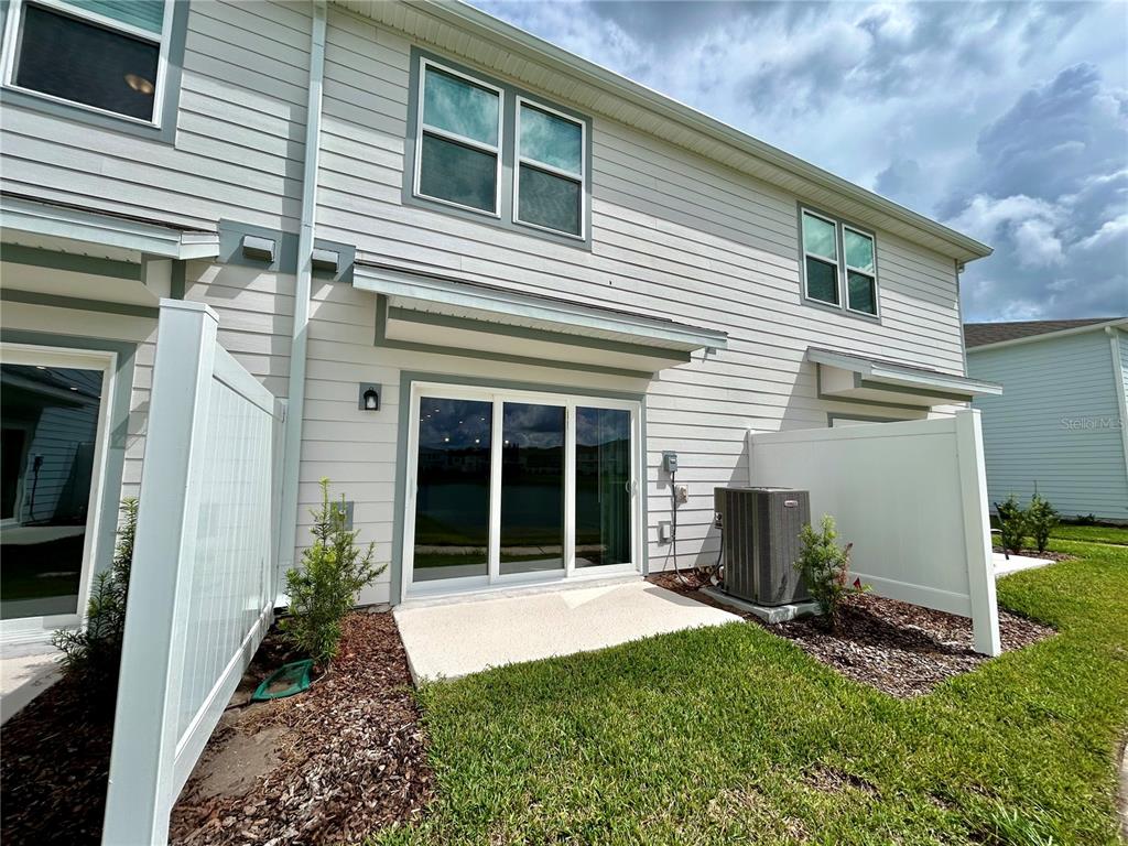 4652 Sparkling Shell Avenue Kissimmee, FL 34746 - Photo 28 of 35 a view of a house with backyard