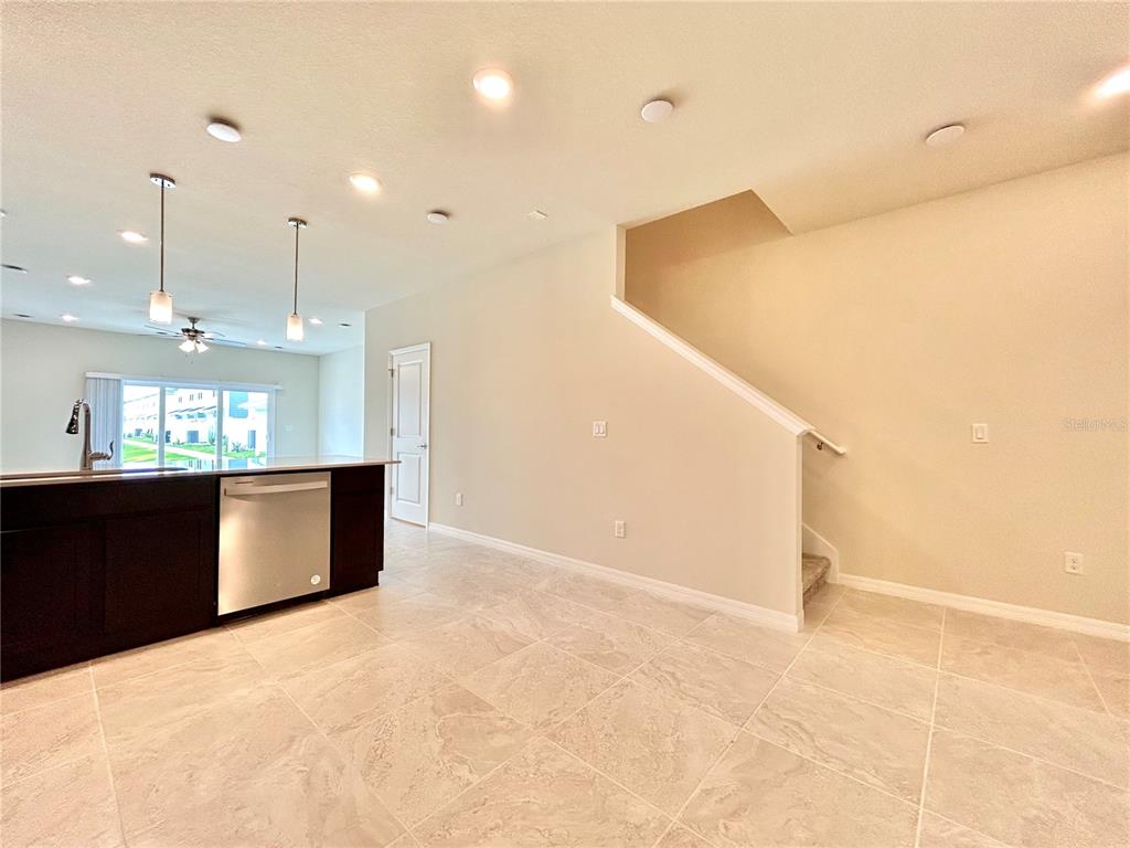 4652 Sparkling Shell Avenue Kissimmee, FL 34746 - Photo 3 of 35 a view of kitchen and kitchen with stainless steel appliances