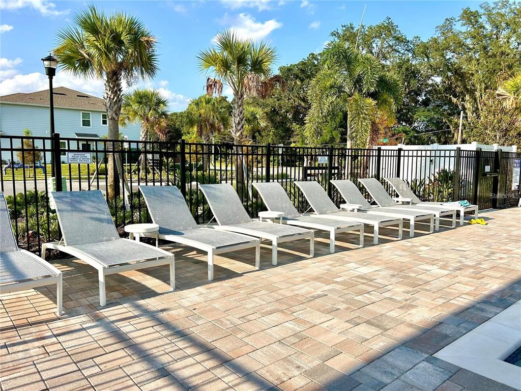 4652 Sparkling Shell Avenue Kissimmee, FL 34746 - Photo 35 of 35 a view of a chairs and table on the terrace