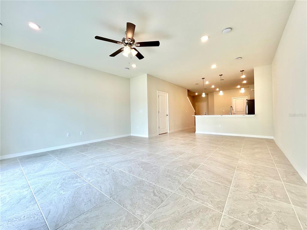 4652 Sparkling Shell Avenue Kissimmee, FL 34746 - Photo 10 of 35 a view of a hallway with a ceiling fan