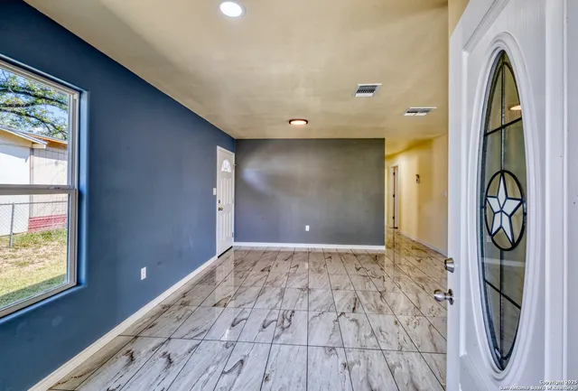 a view of an empty room and window