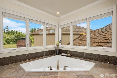 a bath tub sitting in front of a window