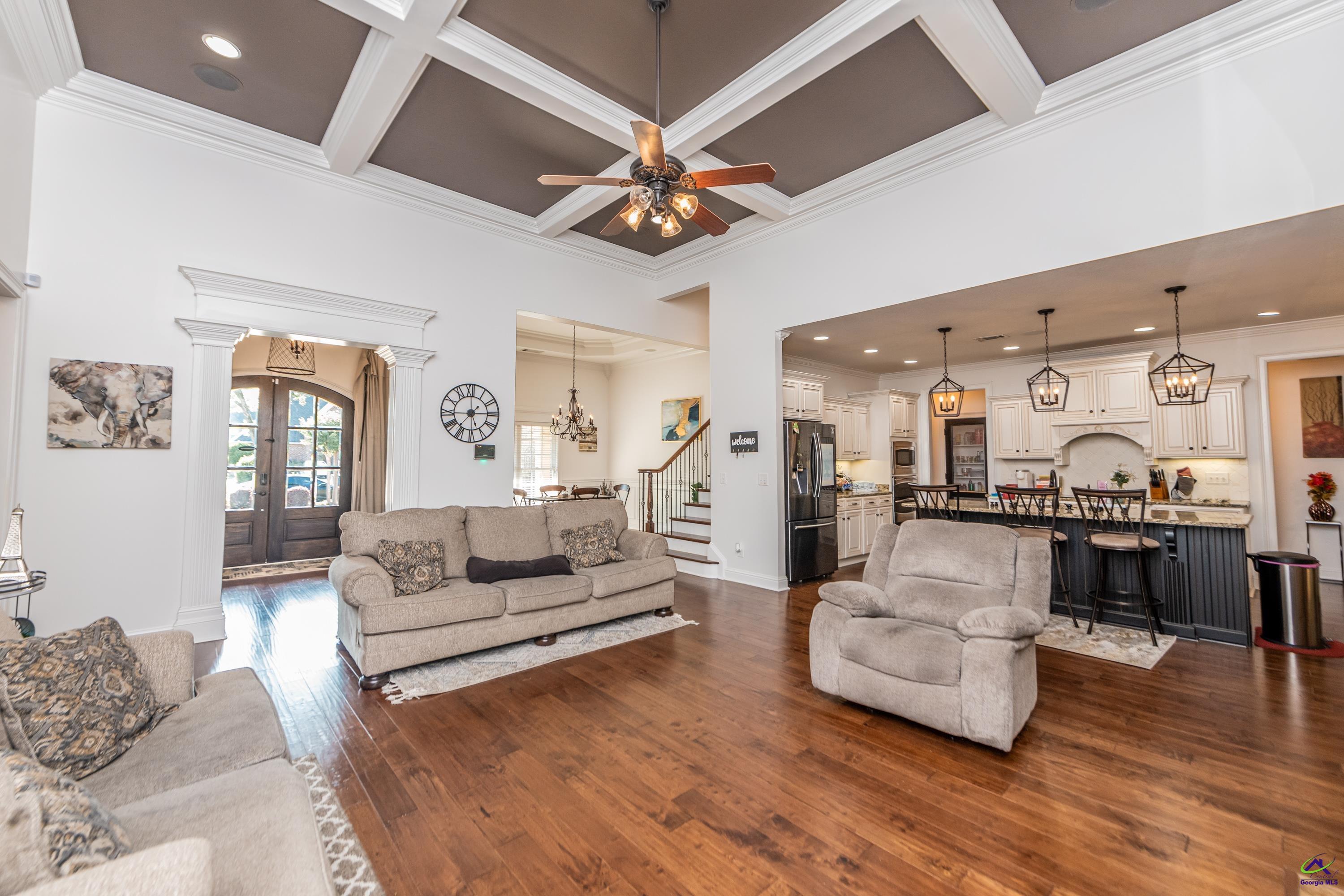 405 Old Bridge Road Warner Robins, GA 31088 - Photo 12 of 58 a living room with furniture kitchen view and a chandelier