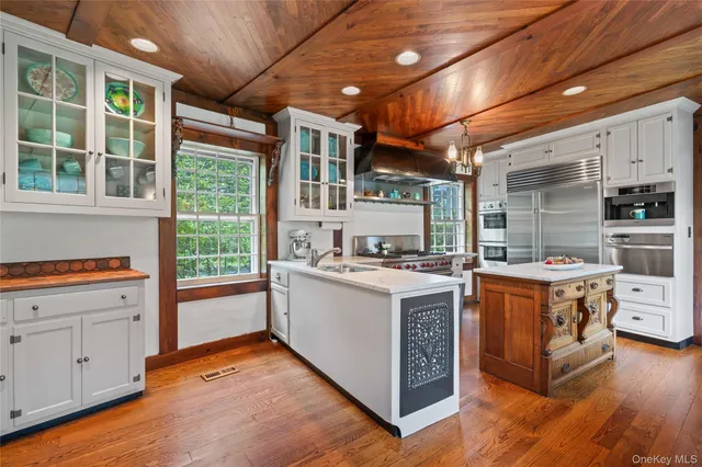 a kitchen with stainless steel appliances granite countertop a stove and a refrigerator