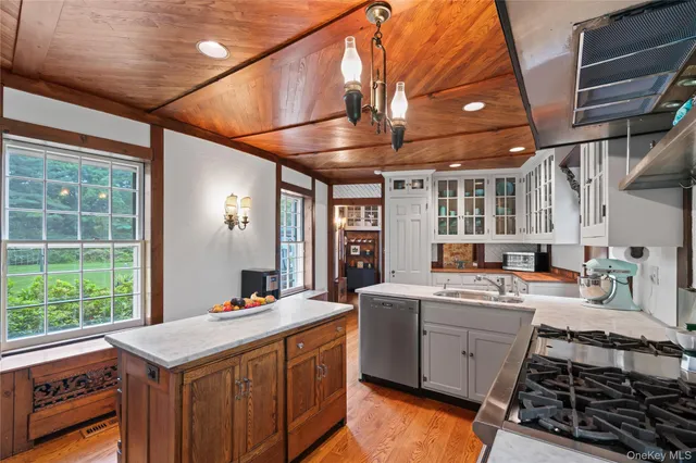 a kitchen that has a lot of cabinets in it