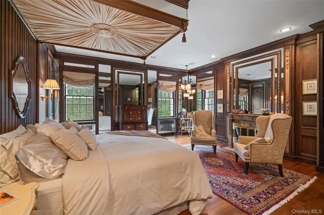 a bed room with a bed and a chair