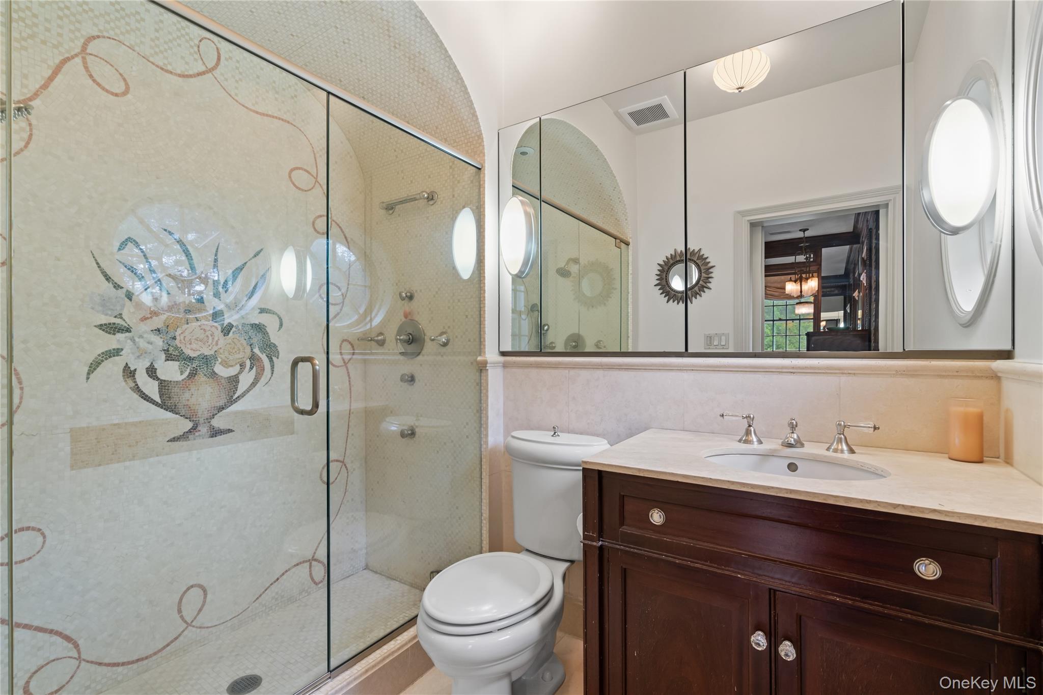 88 Wheatley Road Old Westbury, NY 11568 - Photo 25 of 40 Full bath featuring a stall shower, vanity, and tile walls