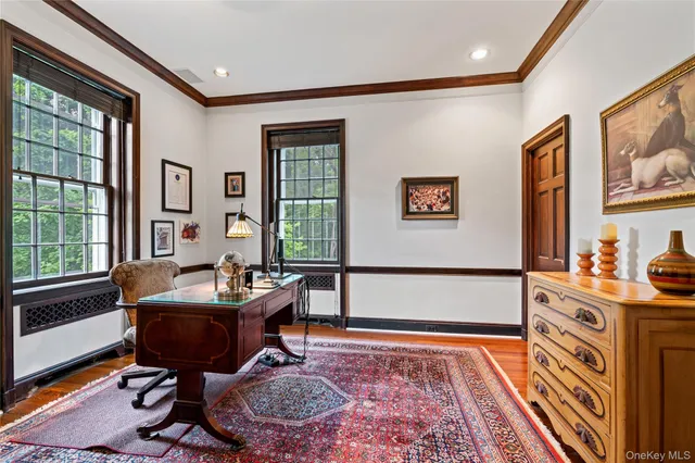 a living room with furniture and a rug