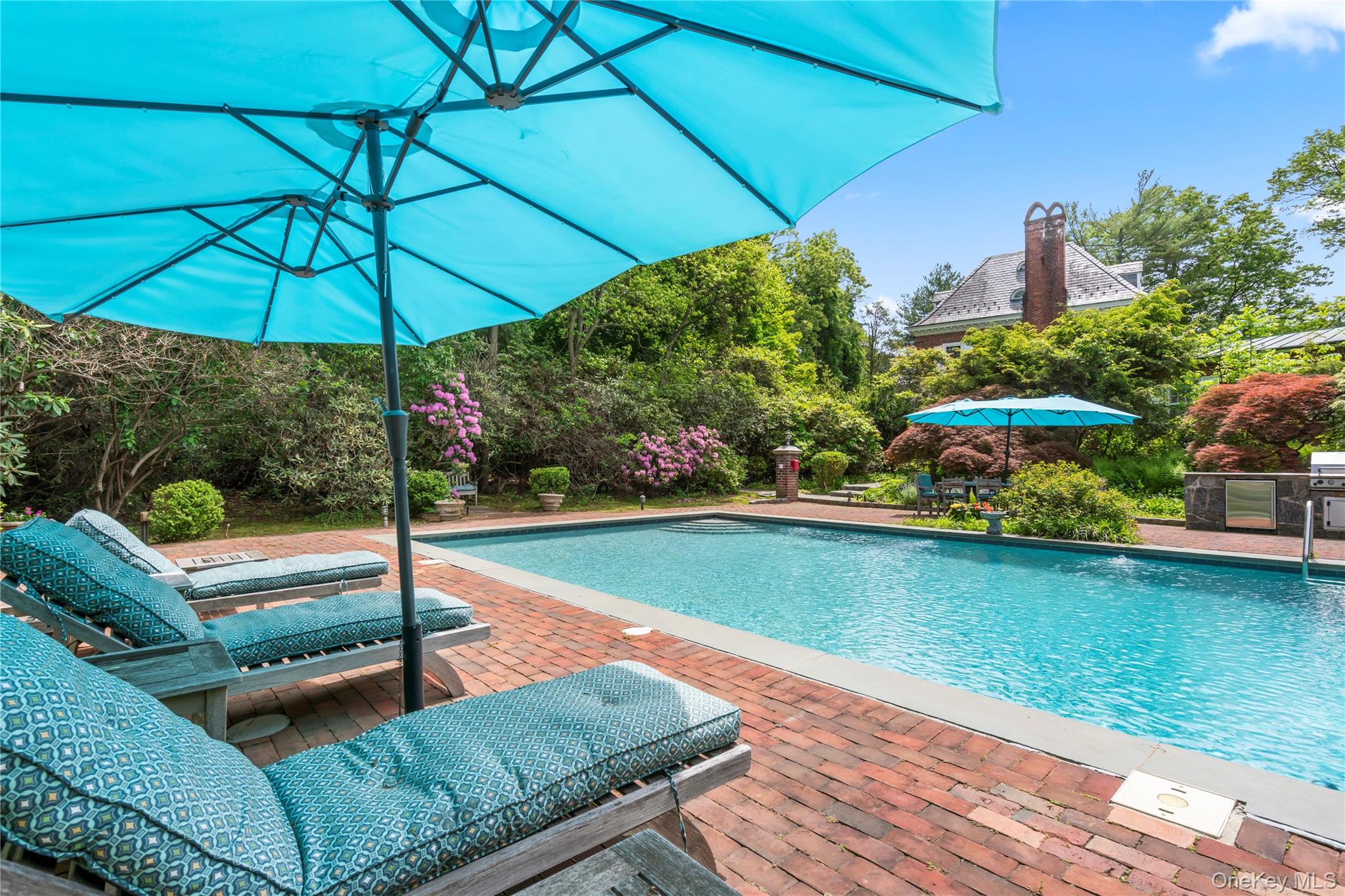 88 Wheatley Road Old Westbury, NY 11568 - Photo 37 of 40 Outdoor pool featuring a patio area